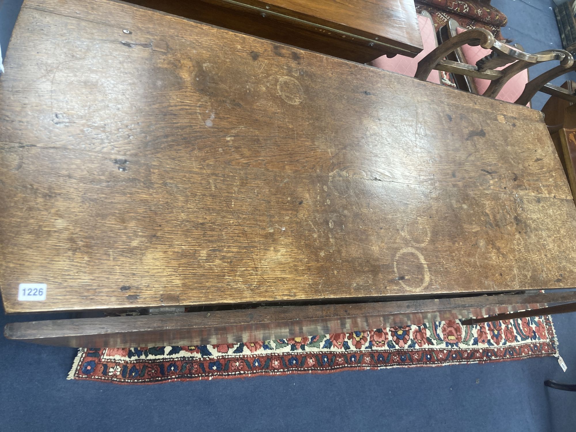 An 18th century oak gateleg dining table, width 173cm, depth 142cm, height 76cm